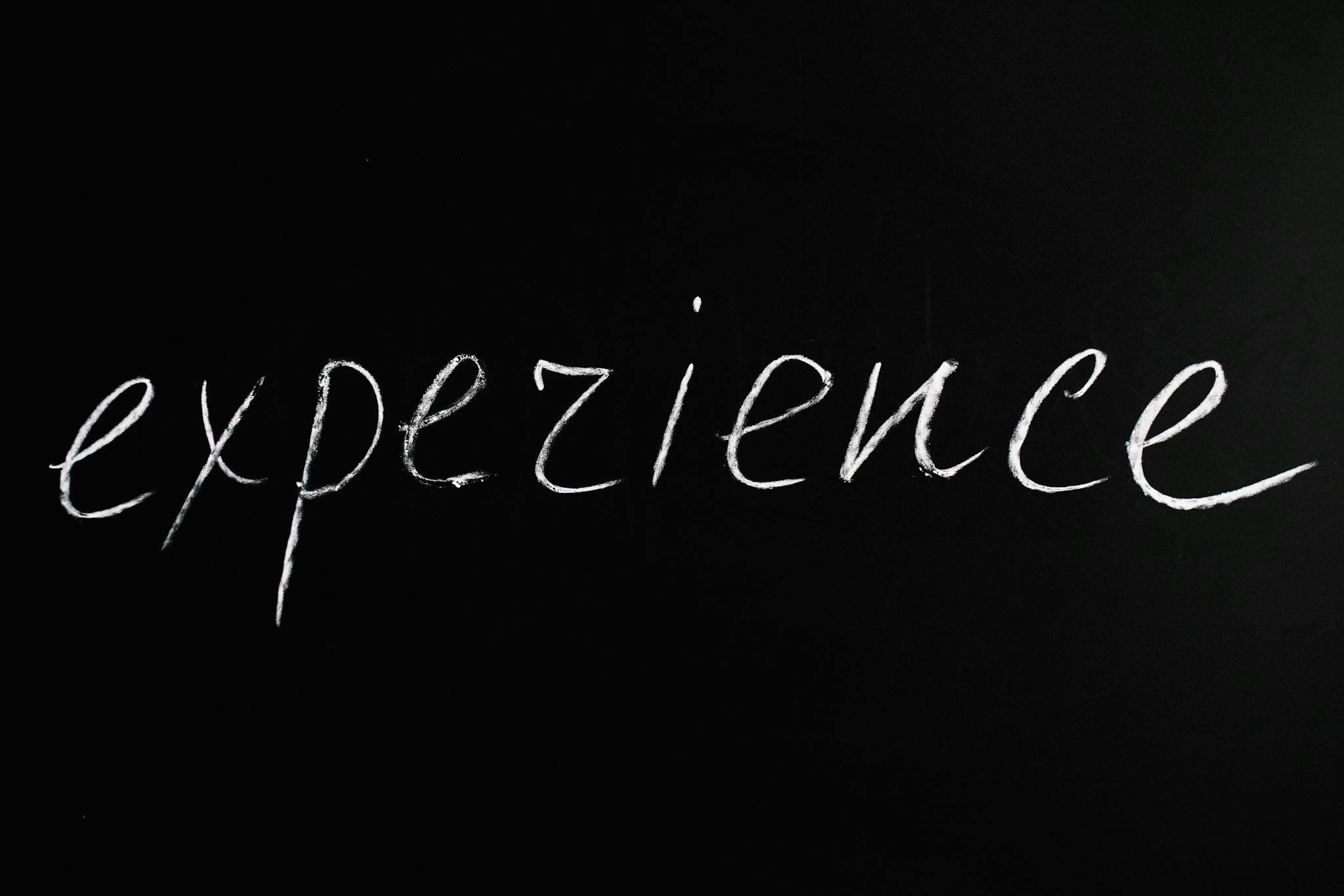 Chalkboard showing 'expezience', emphasizing creativity or error.